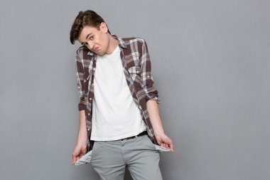 Man exhibiting his empty pockets