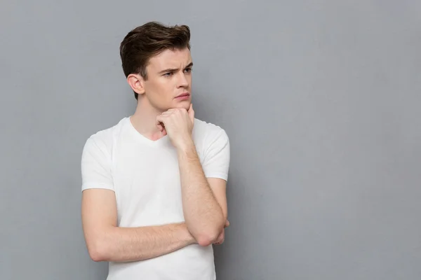 Portrait of pensive concentrated young man — Zdjęcie stockowe