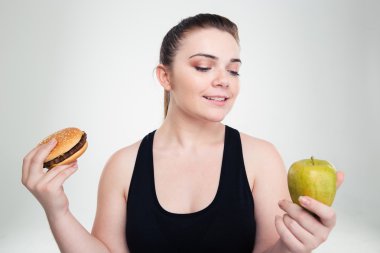 Şişman kadın Burger veya elma arasında seçme