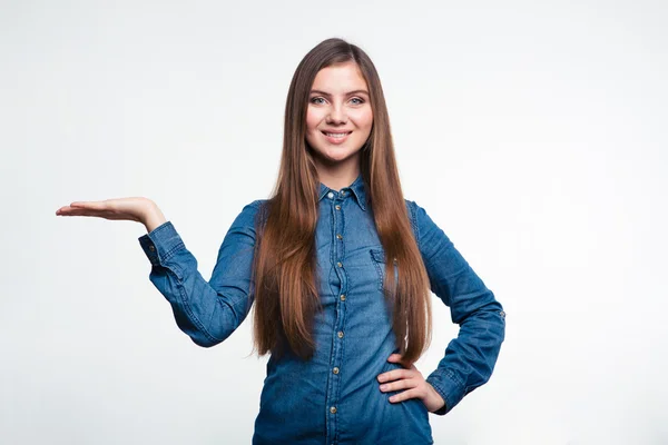 Smiling woman holding copyspace on the palm — Stock Photo, Image