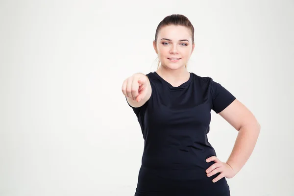 Fat woman in sportswear pointing finger at camera — Stock Photo, Image