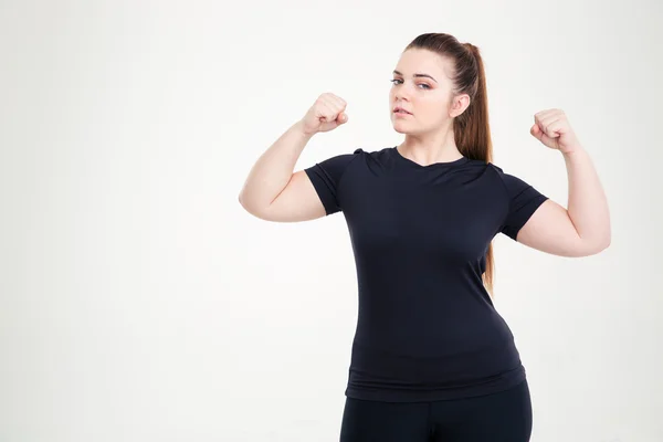 Piękna kobieta tłuszczu pokazano jej biceps — Zdjęcie stockowe