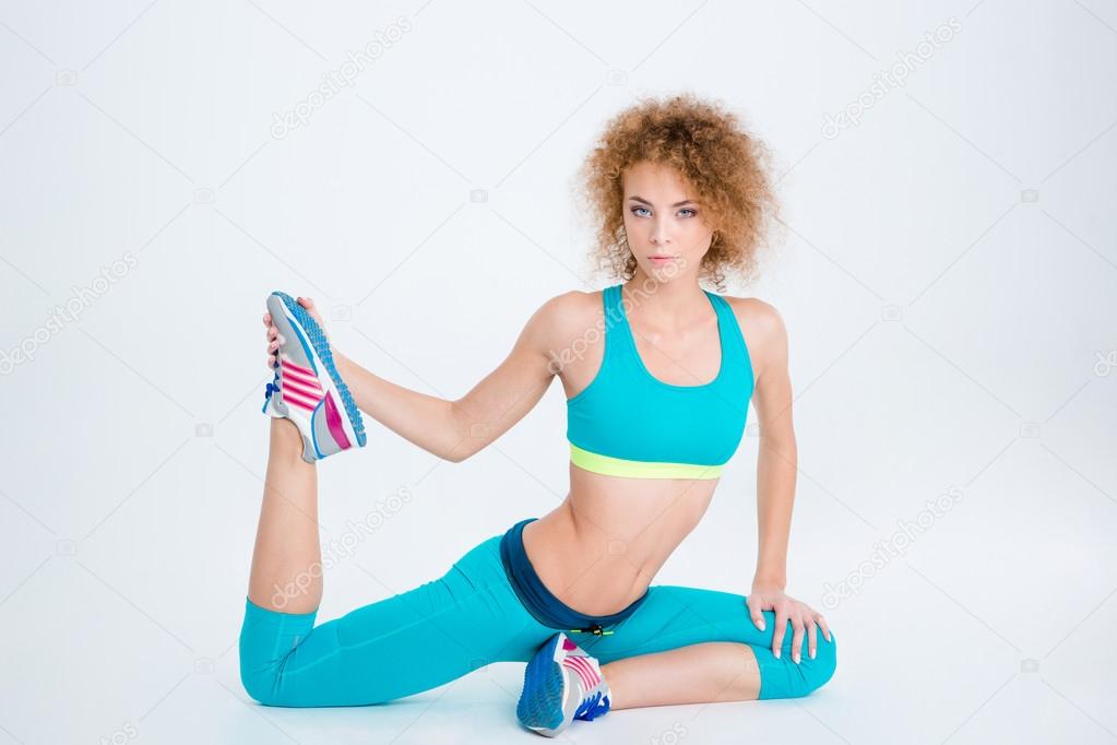 Sports woman stretching legs