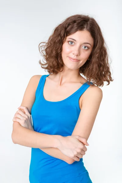 Young woman standing with arms folded — Stock Photo, Image