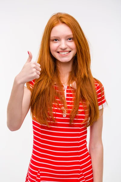 Portrait of happy young redhead woman with thumbs up gesture — 图库照片