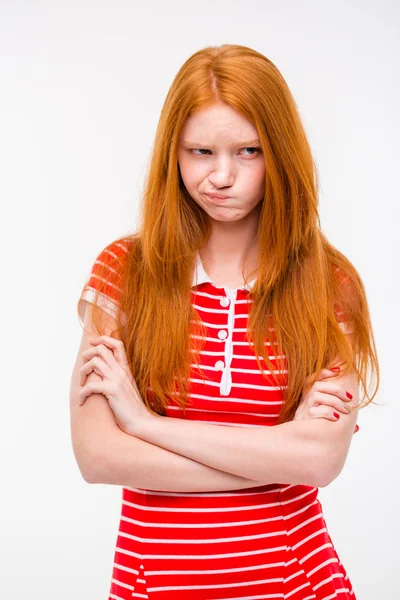 Cute offended girl standing with hands crossed — 스톡 사진