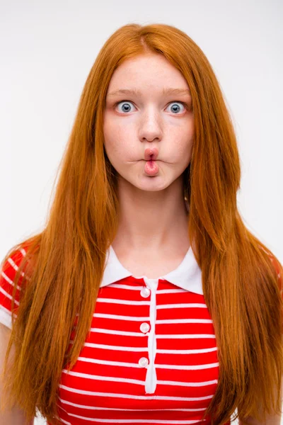 Funny redhead girl fooling aroung and making funny faces — 图库照片