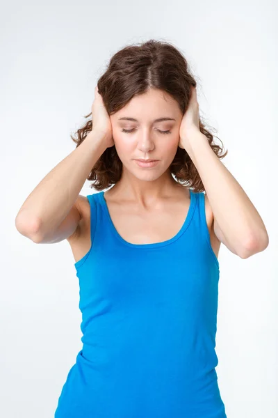 Portrait of a young woman closed her ears Stock Image