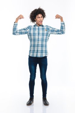 Cheerful afro american man showing his biceps