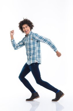 Smiling afro american man running