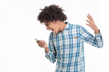 Afro amerian man screaming on smartphone
