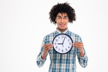 Happy afro american man holding wall clock