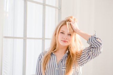 Portrait of relaxed woman with tousled hair 