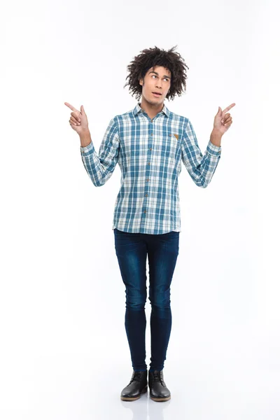 Thoughtful afro american man pointing fingers away — Stock Photo, Image