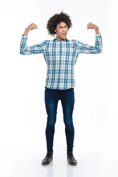 Cheerful afro american man showing his biceps — Stockfoto