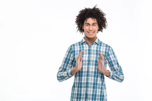 Afro american man holding something invisible — 스톡 사진