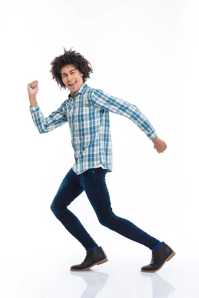 Smiling afro american man running — Stock fotografie