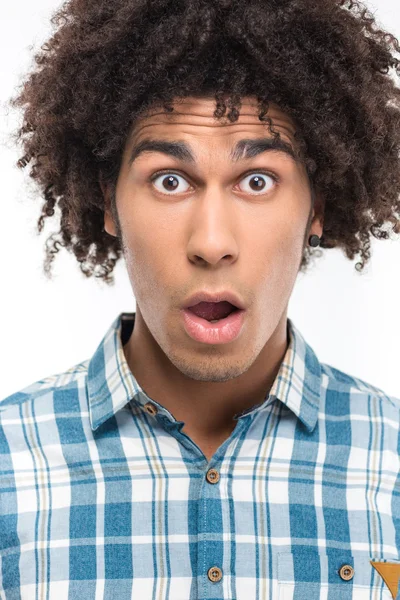 Shocked afro american man with curly hair — Stock fotografie