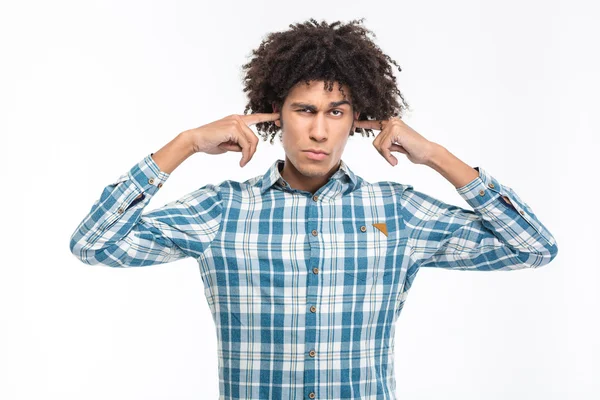 Serious man covering his ears — Stok fotoğraf