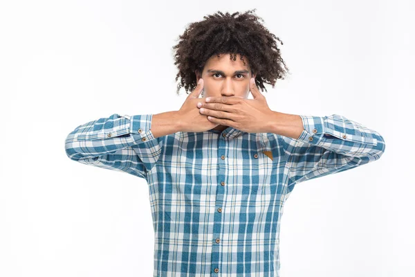 Afro american man covering his mouth with palms — Stockfoto