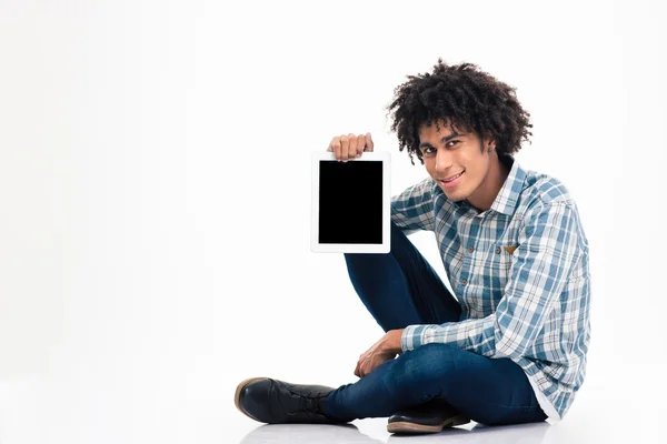 Afro american man showing blank tablet computer screen — Stockfoto