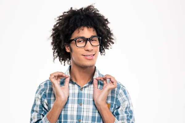 Funny afro american man in glasses holding collar of shirt — стокове фото