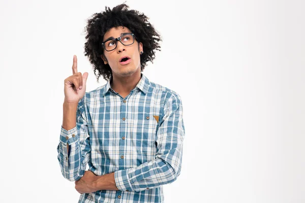 Pensive afro american man pointing finger up — Stockfoto