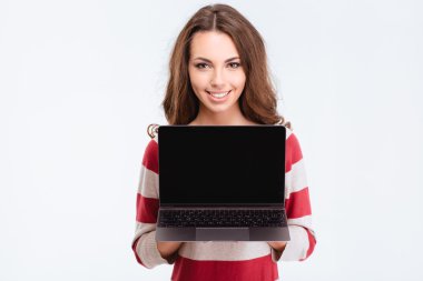 Happy cute woman showing blank laptop compter
