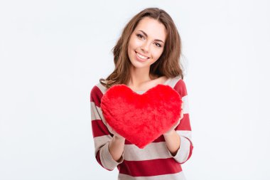 Happy cute woman holding red heart 