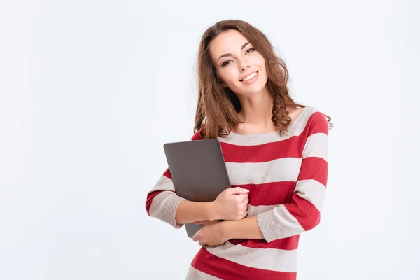 Happy cute woman holding laptop computer — 图库照片