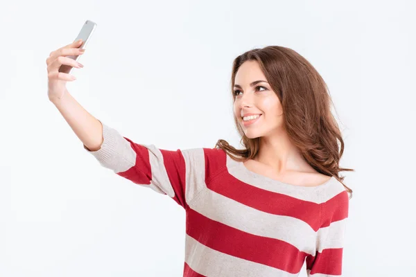 Portrait of a smiling woman making selfie photo — Stock Photo, Image