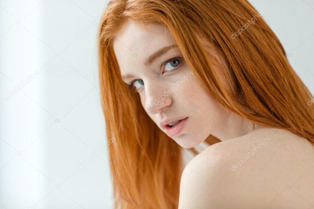 Redhead woman looking at camera 
