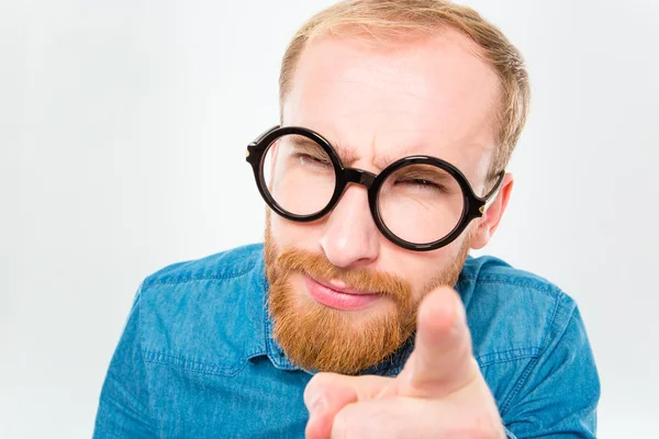 Suspicious bearded man in funny round glasses pointing on you — Stock Photo, Image