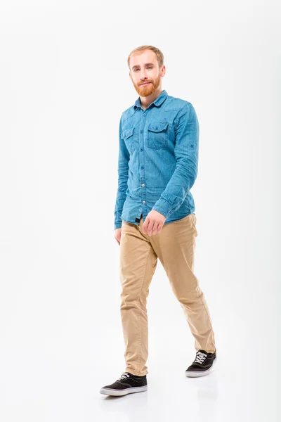 Positive male with beard walking and looking camera — Φωτογραφία Αρχείου