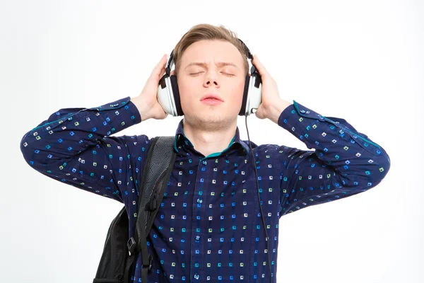 Young male listening to music with eyes closed — Stockfoto