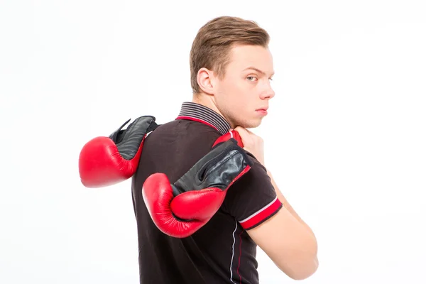 Annoyed sad blond young male carrying boxing gloves — Stock Photo, Image