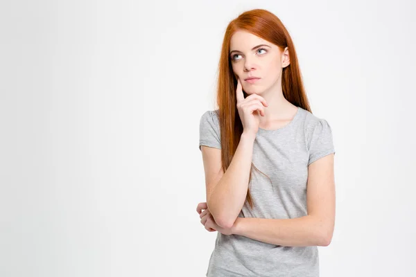 Thoughtful female with red hair thinking and looking away — Φωτογραφία Αρχείου