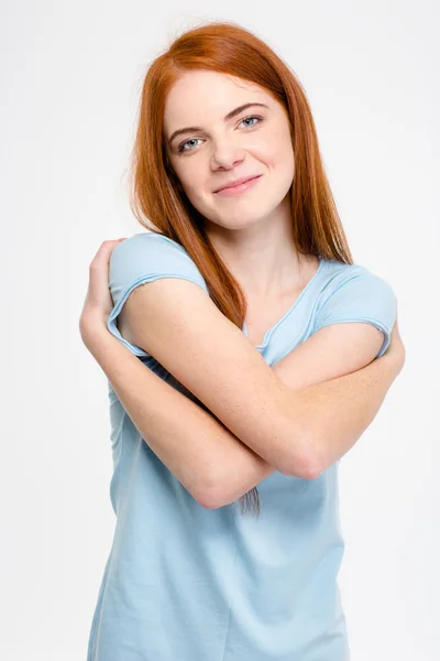 Attractive sensual smiling young woman hugging herself — Stockfoto