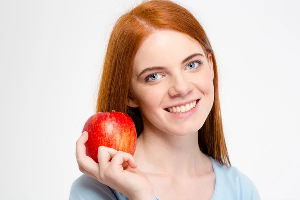 Happy redhead woman holding apple — Φωτογραφία Αρχείου