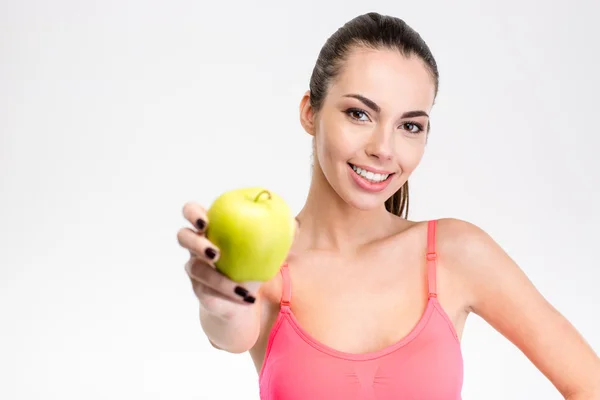 Cute lovely smiling fitness girl holding an apple — Stock Photo, Image