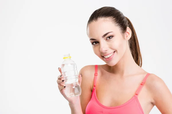 Cute lovely fitness girl holding a bottle of water — Stock Photo, Image