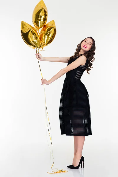 Amusing positive lovely female posing with star shaped balloons — Zdjęcie stockowe