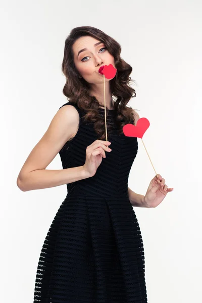 Amusing charming woman posing with paper heart and lips booth — ストック写真