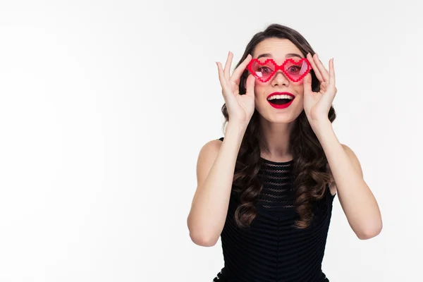 Portrait of happy funny woman in red heart shaped glasses — Stockfoto