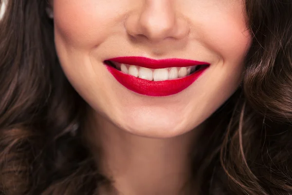 Lovely red lips smile of curly woman with white teeth — Stok fotoğraf