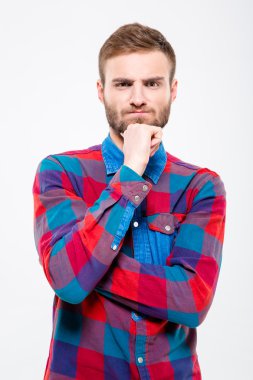 Thoughtful casual man looking at camera