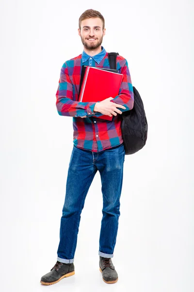 Happy male student holding books — 图库照片