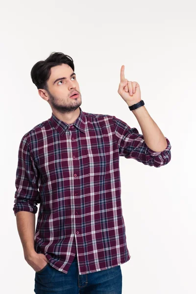 Portrait of a pensive man pointing finger up — Stock Photo, Image