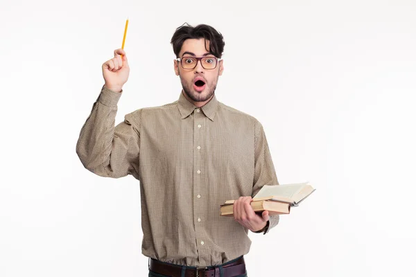 Surprised man standing with book — Stock Photo, Image