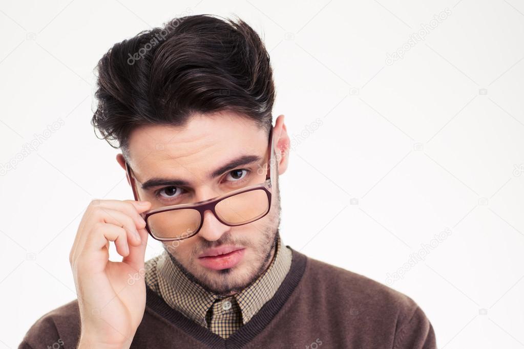 Serious man in glasses looking at camera